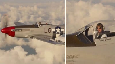 Tom Cruise accepts an award while flying a WW2 fighter plane