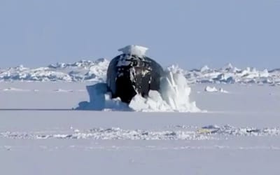 Watch this $2 billion submarine emerge from a thick layer of ice 