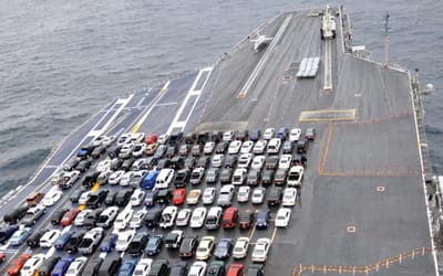 US Navy turns aircraft carrier into $5B floating car transport with sweet rides and surprising choices