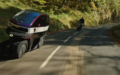 This electric four-wheeler leans like a motorcycle to weave through traffic with ease