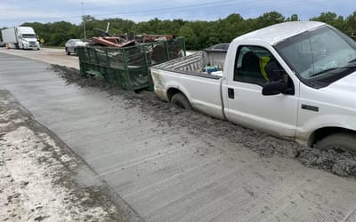 Truck driver makes comical error while towing trailer on Tennessee road and drives through wet cement