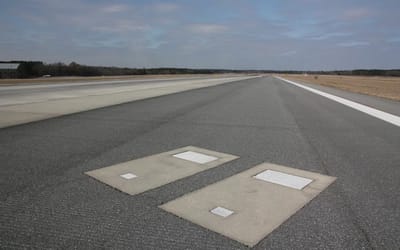 Georgia has the only active runway in the world that has two graves on it, but for an interesting reason