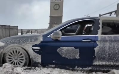 Abandoned BMW turns into a tourist destination after being battered by ice and wind for days