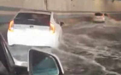 Drivers struggle through three feet of water as Boston tunnel floods