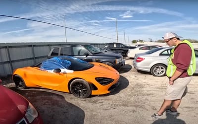 Brand new $300,000 McLaren is among junk cars despite seemingly being in mint condition