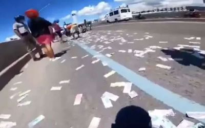 Over $50,000 cash flies from oblivious motorcyclist’s backpack as he drives down freeway