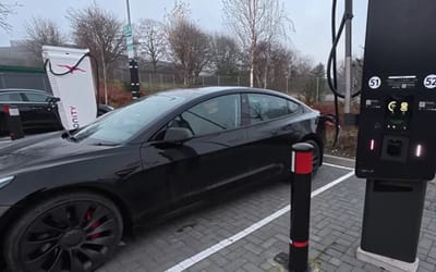 Man with Tesla Model 3 compares a slow EV charger and a fast EV charger to see which saves the most money and is left surprised
