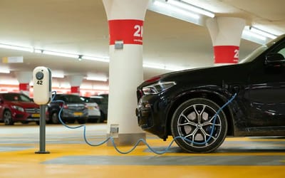 Parking a gas car in a space designated for EVs is often illegal - and in Arizona, the minimum fine is $350
