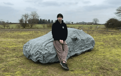 Man pulls back cover to reveal a fake 90s sports car and realizes he now owns a contender for the worst vehicle ever made