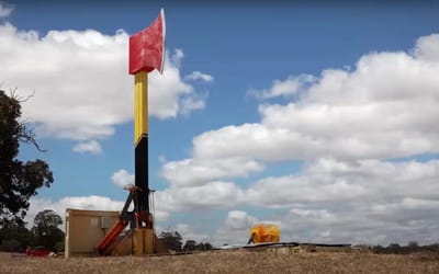 Watch these Australians chop a car in half with a giant axe