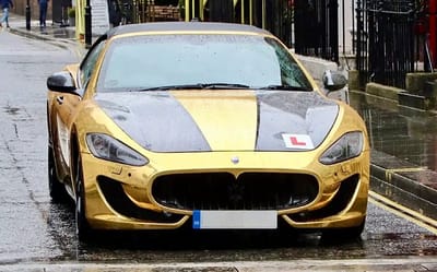 Gold-plated Maserati GranCabrio with L-plates on ended up on back of truck in London