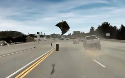 Footage shows runaway tire launching Kia Soul 10 feet into the air