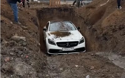 Russian daredevil turns his Mercedes into a 'time capsule'… and buries himself with it