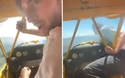 Pilot climbs out of cockpit and restarts engine by hand in death-defying video