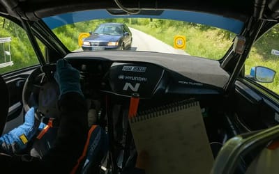 Rally driver displays superhuman reaction time as civilian car illegally enters race track