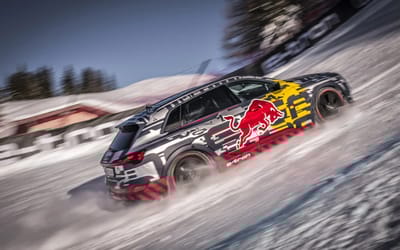 Man braves ice, snow and gravity to drive a car up one of the world's steepest and most dangerous ski slopes
