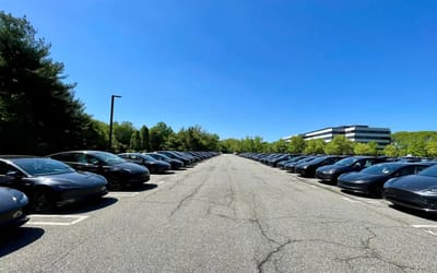 Tesla is storing so many unsold Teslas in America’s parking lots you can allegedly see them from space