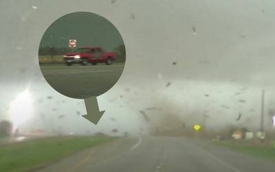 Watch the unbelievable moment a tornado flips a Chevy truck before blowing it right side up again