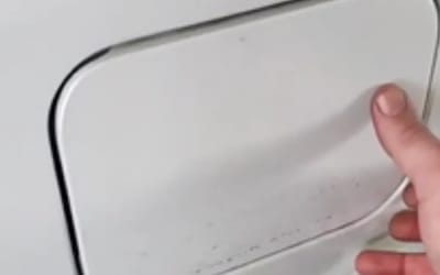 Mechanic's diagnosis of Toyota with reported faulty fuel door lasts exactly 13 seconds