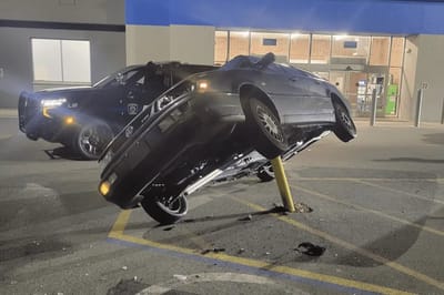 Hey, you can’t park there! VW owner impales car on parking lot pole
