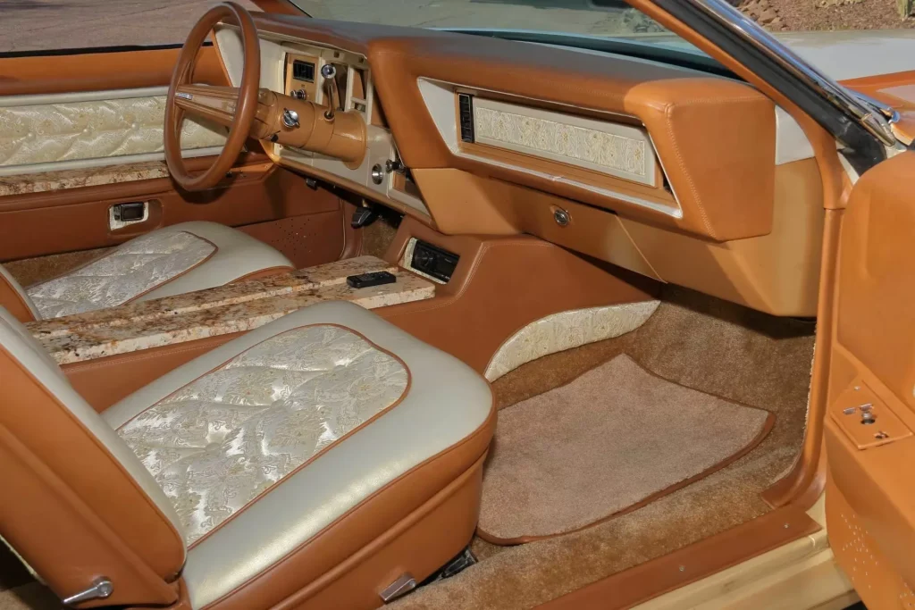 This 1973 Lincoln Continental was transformed into a chrome-heavy custom with a real granite interior and a massive 460 V8