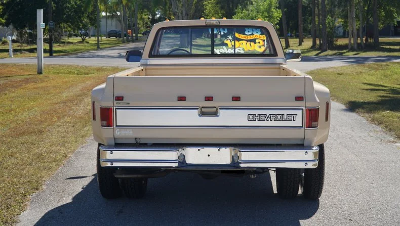 A 1988 Chevy K3500 Silverado with just 55 miles sold for $100,000, sparking debate over whether untouched originality beats modern truck tech