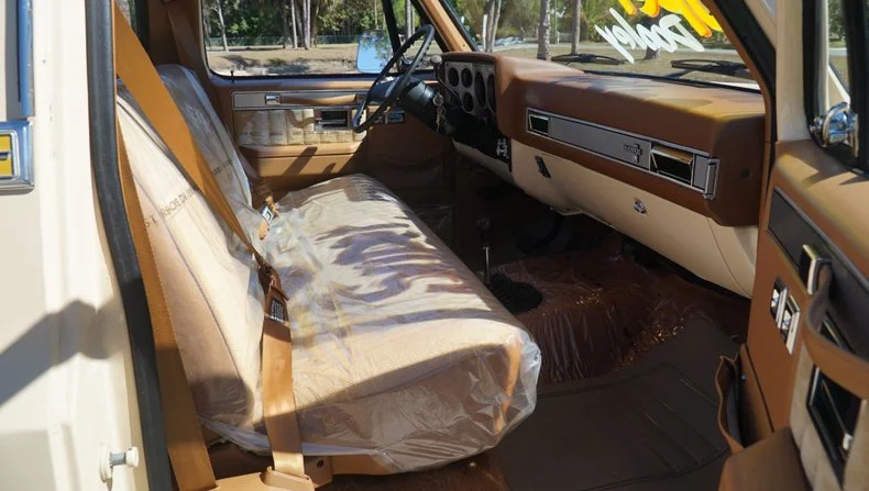 A 1988 Chevy K3500 Silverado with just 55 miles sold for $100,000, sparking debate over whether untouched originality beats modern truck tech