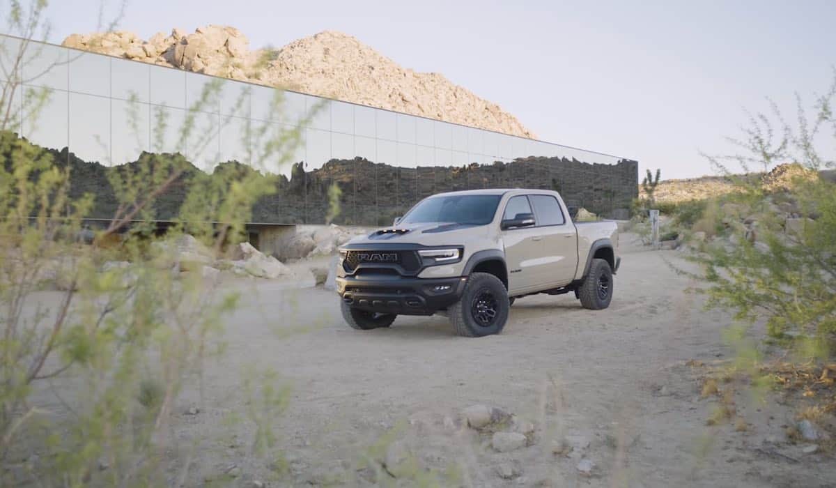 2022 Ram 1500 TRX Sandblast in front of the Invisible House