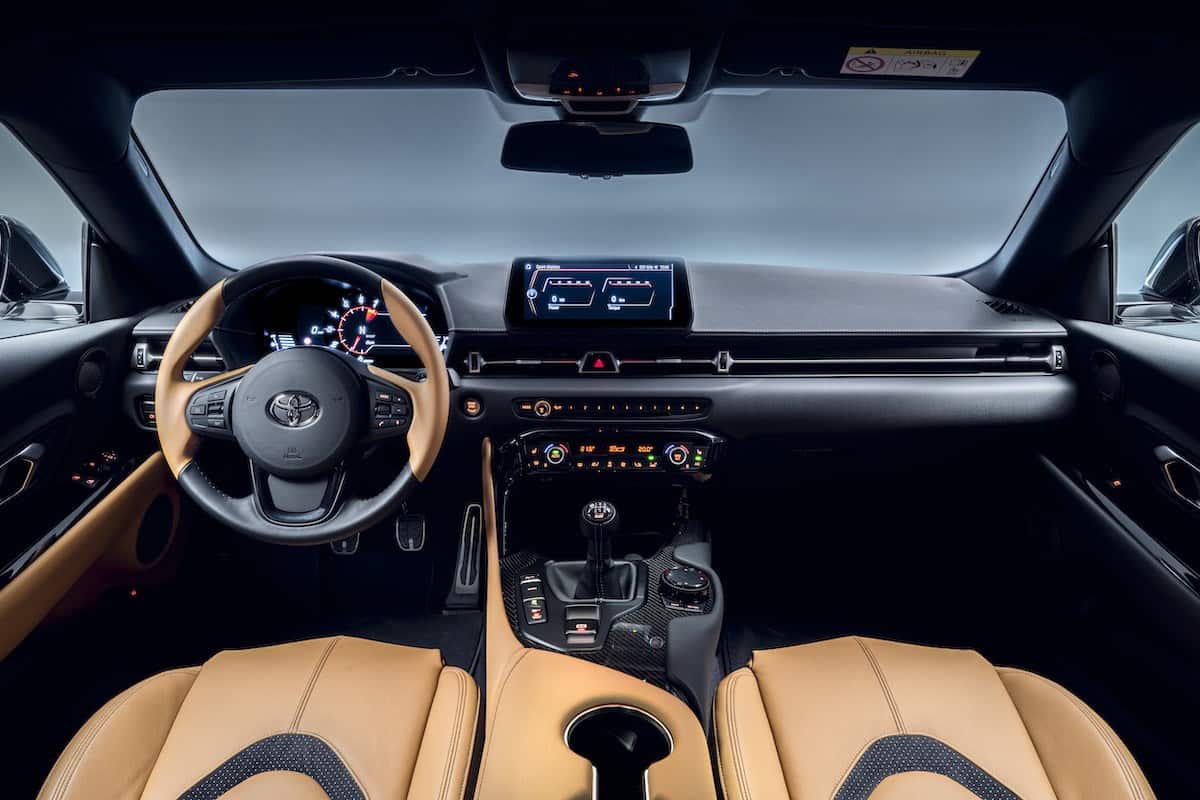 The tan interior of the Toyota Supra manual.