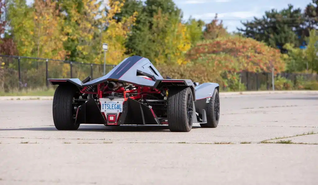 Canadian who got the perfect license plate for Nemesis R1 racecar he built tells us it's working and cops leave him be