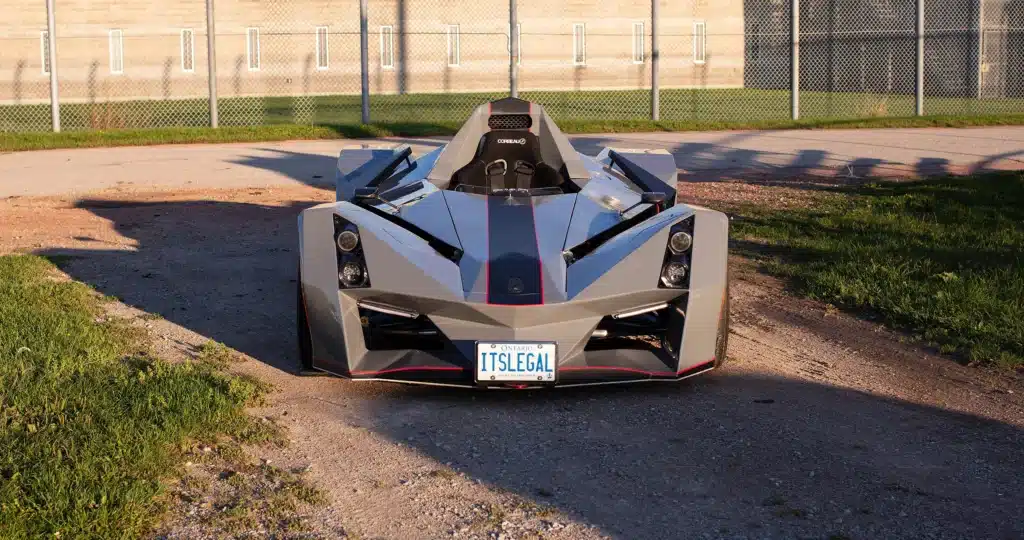 Canadian who got the perfect license plate for Nemesis R1 racecar he built tells us it's working and cops leave him be