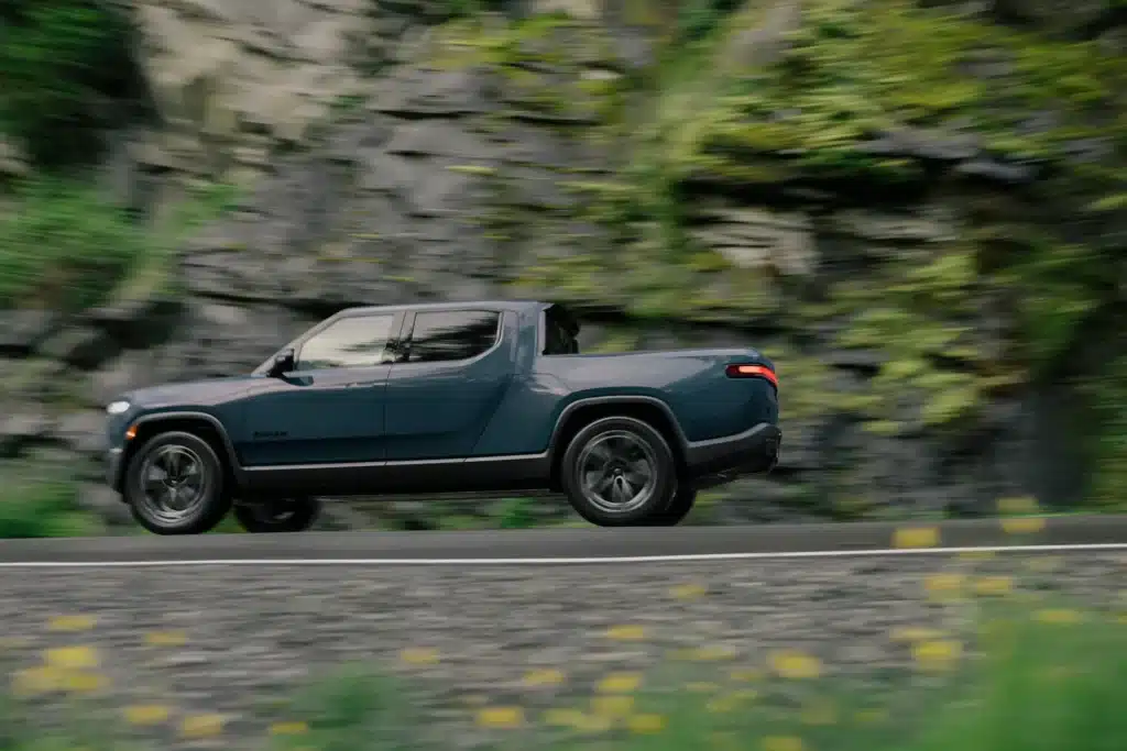 Rivian R1T completes 460-mile road trip with 7% battery remaining, using free charging network despite navigation and charger issues