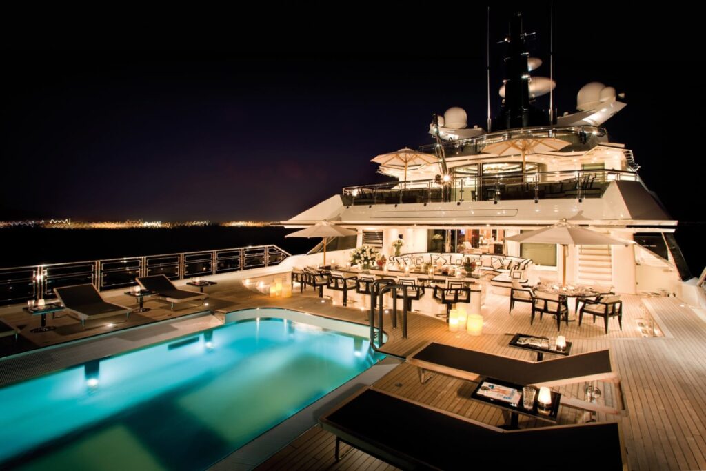 267-foot yacht Alfa Nero moored in Antigua, pool by night