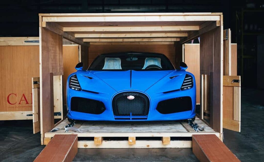 A rare Bugatti Mistral in French Racing Blue with crystal gear shifter and W16 engine was delivered by Miller Motorcars in a dramatic unboxing