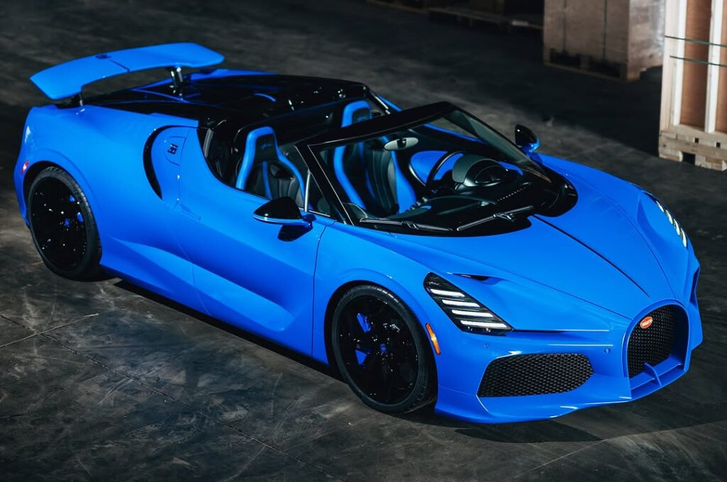 A rare Bugatti Mistral in French Racing Blue with crystal gear shifter and W16 engine was delivered by Miller Motorcars in a dramatic unboxing