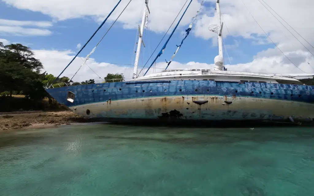 50-meter superyacht has been stuck on a reef since 2015 and locals are doing everything they can to salvage it