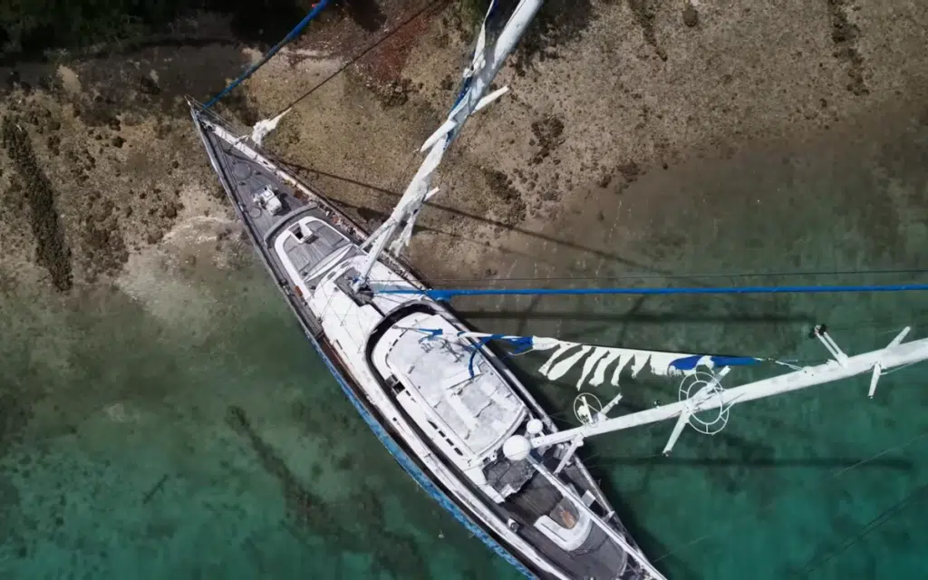 50-meter superyacht has been stuck on a reef since 2015 and locals are doing everything they can to salvage it