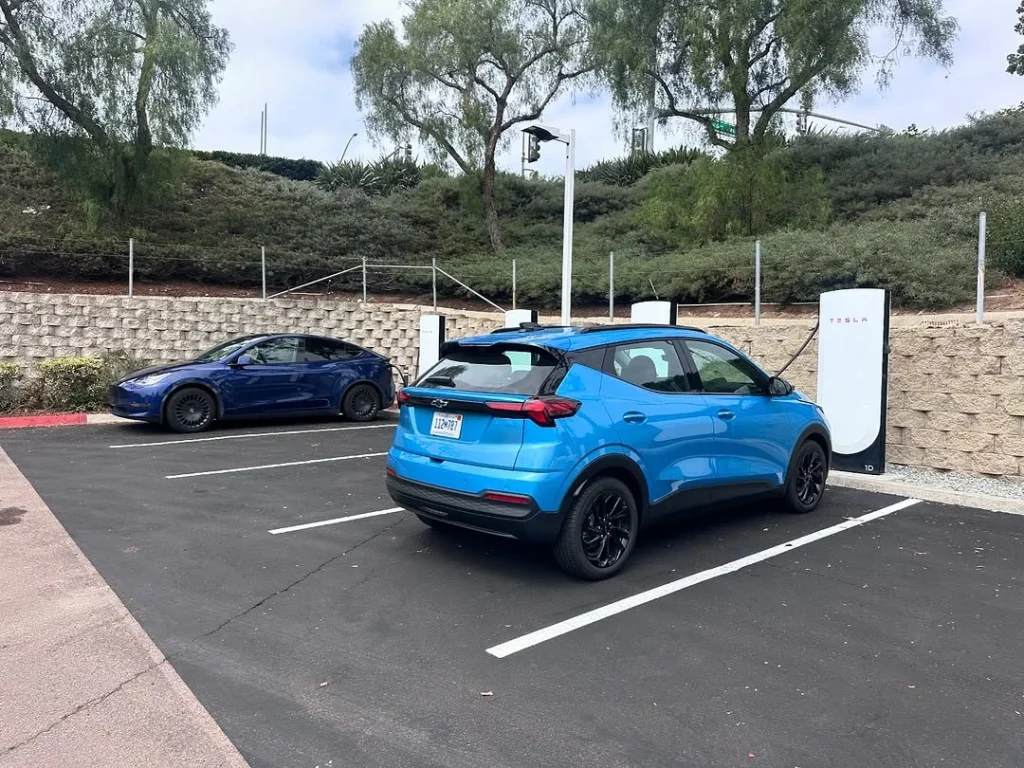 The 2027 Chevy Bolt EV was seen charging in California with no camouflage, as GM confirms EV charging upgrades and new battery tech