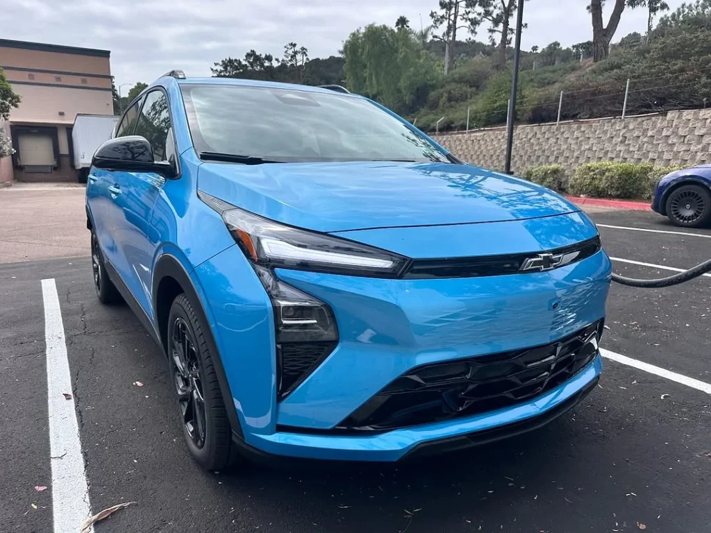 The 2027 Chevy Bolt EV was seen charging in California with no camouflage, as GM confirms EV charging upgrades and new battery tech