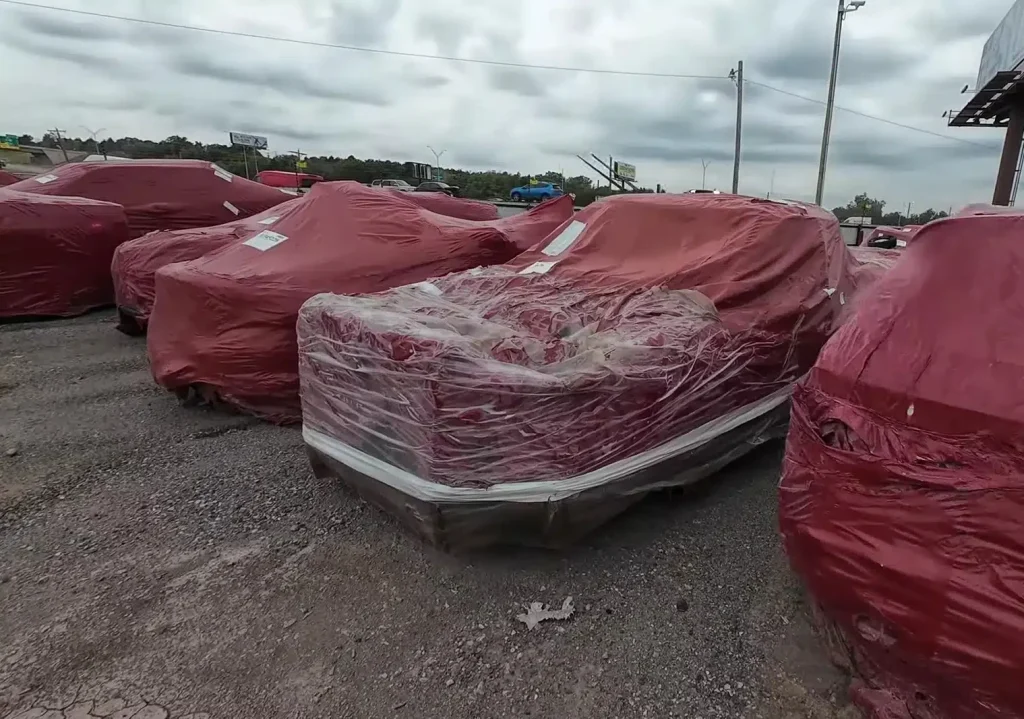 A YouTuber found a car graveyard in Oklahoma packed with cars that are wrapped in red plastic bags