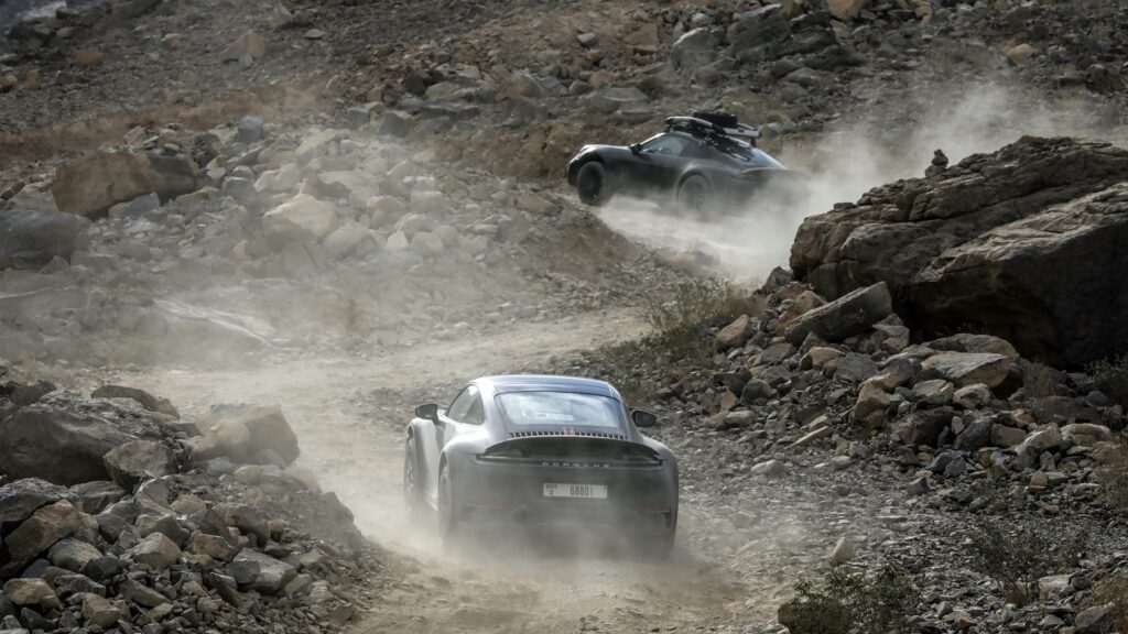 A pair of Porsche 911 Dakar on gravel