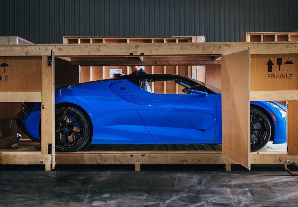 A rare Bugatti Mistral in French Racing Blue with crystal gear shifter and W16 engine was delivered by Miller Motorcars in a dramatic unboxing