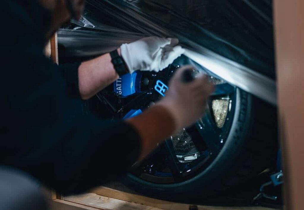 A rare Bugatti Mistral in French Racing Blue with crystal gear shifter and W16 engine was delivered by Miller Motorcars in a dramatic unboxing
