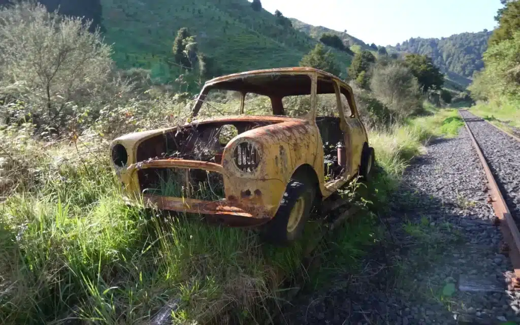 Canadian man's Golf Cart Train trip through New Zealand finds cool abandoned car