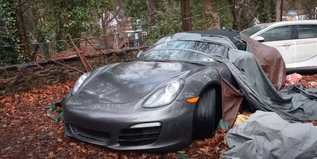 Man explores abandoned mansion in small American town where owner left luxury car collection to rot