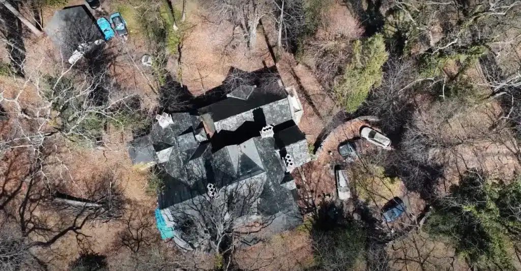 Man explores abandoned mansion in small American town where owner left luxury car collection to rot