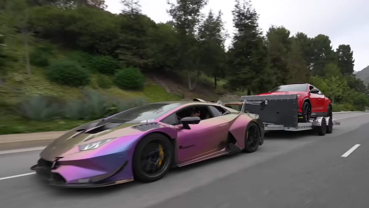 Modified Lamborghini Huracan towing a Urus