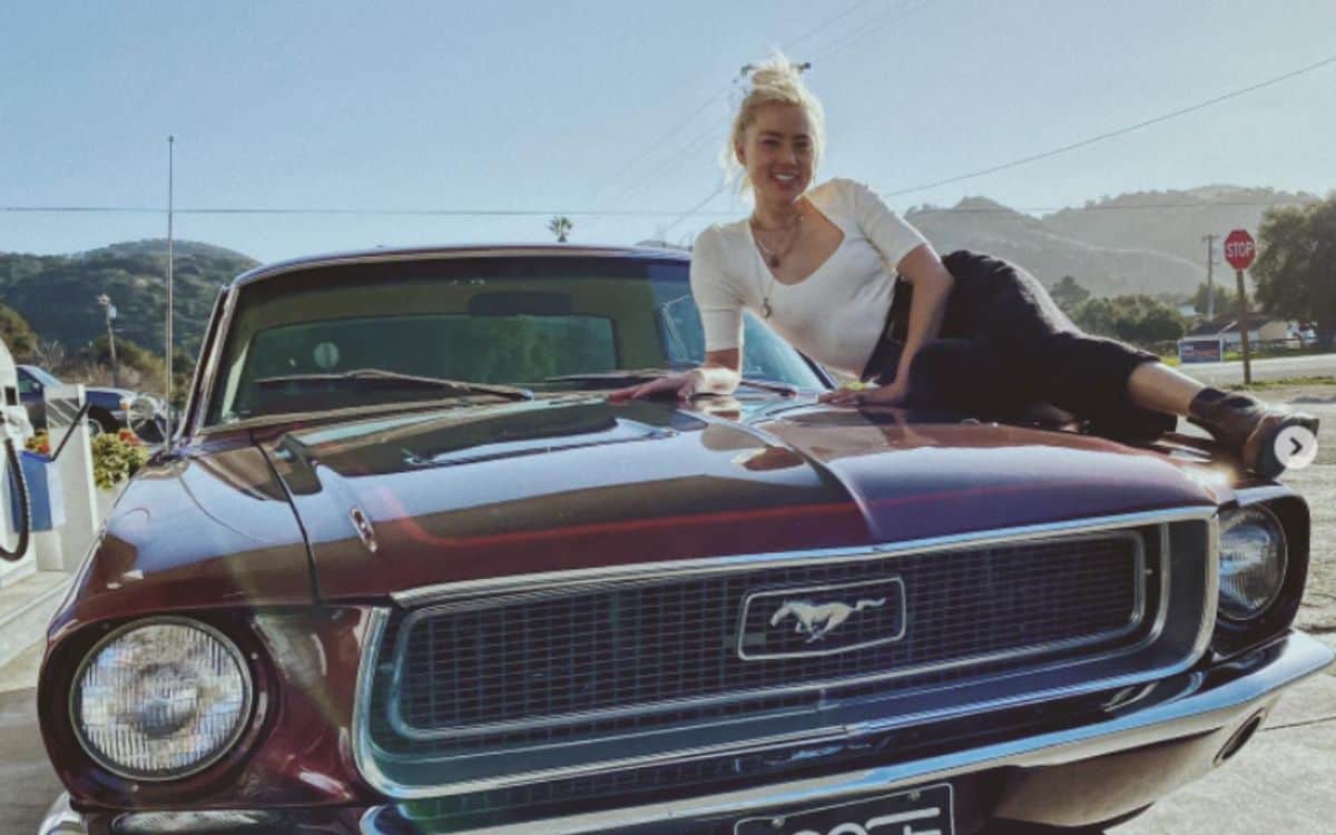 Amber Heard and her cherry red Ford Mustang