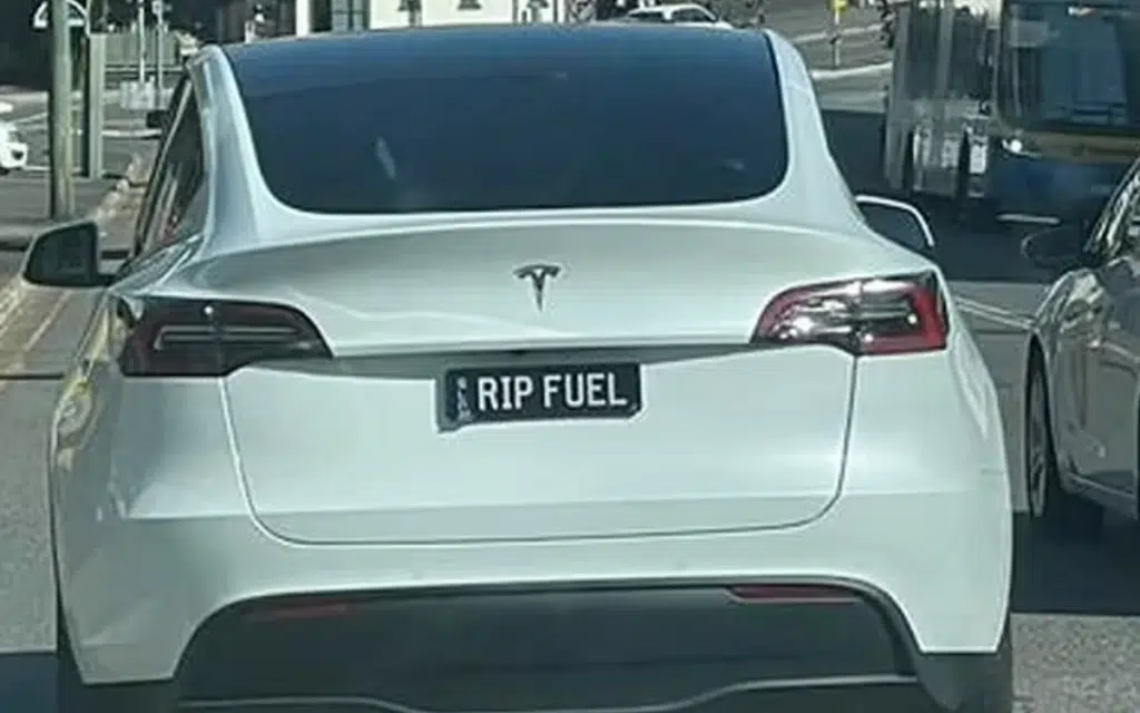 Tesla drivers in Australia have been putting cheeky messages on their license plates that fuel rivalry between EV and gas owner