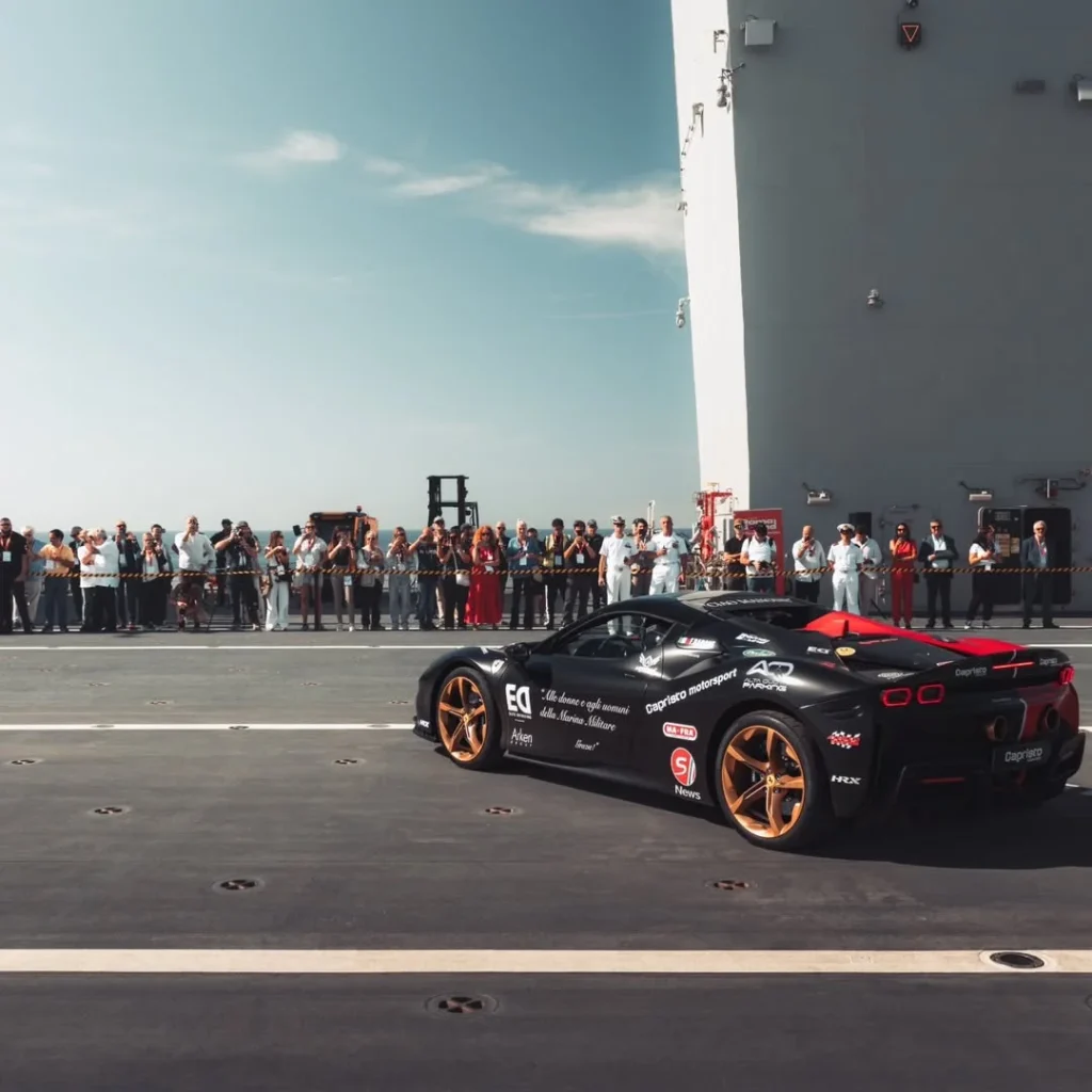 An Italian racing driver set an unusual record by driving a Ferrari SF90 Stradale on an aircraft carrier